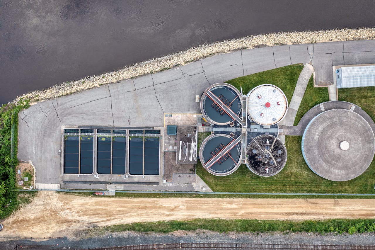 brand-03 Top-down aerial view of a water treatment plant in Red Wing, MN near a river.