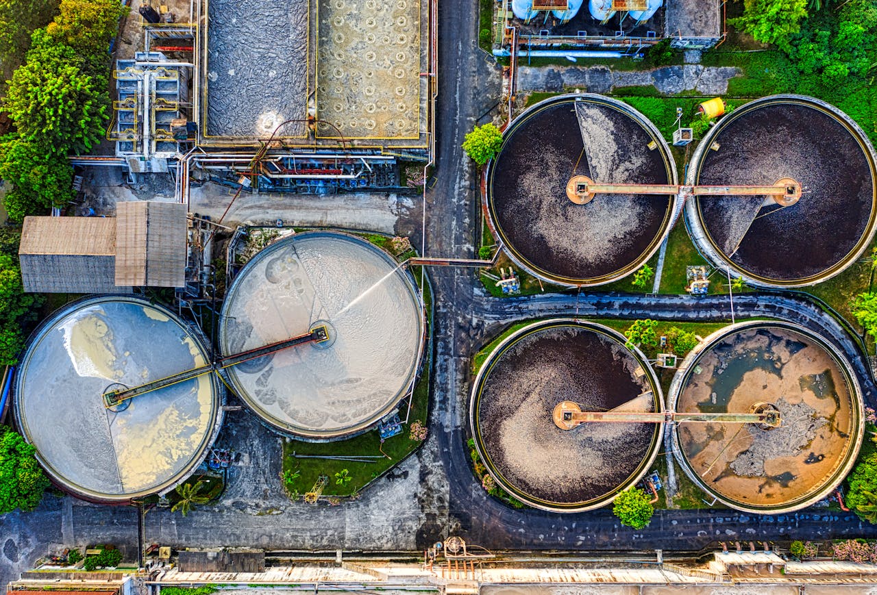 mobile-01 Top-down view of a water treatment plant in an industrial area of Indonesia.